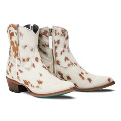 FINAL SALE! Cowpoke bootie by Lane is authentic hair on hide cowhide leather. No two are alike! Heirloom quality ankle boots with a western influence. The classic snip toe profile with cowhide leather features white black and or brown hair. The cow print and turquoise sole are a gorgeous combination. *NOTE: some boots are brown and white hair and others black and white hair. If you have a very strong preference, email me first to see what we have available in your size. Otherwise we send what is Brown And White Hair, Black And White Hair, Red Cowgirl Boots, Lane Boots, Plain Jane, Western Cowgirls, White Hair, Cow Print, Cowgirl Boots