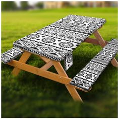 a black and white patterned picnic table cover