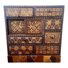 an old wooden dresser with intricate designs on it