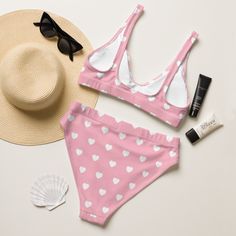 It’s too easy to fall in love with this bikini set. Removable pads and its double-layer make it comfy to wear all day by the pool or at the beach.• Fabric composition recycled polyester, 19% LYCRA XTRALIFE• Double-layered and non-reversible• Removable padding• Tear-away care label• Zig-zag stitching EU sourced from Spain, Germany, Taiwan, Vietnam, Cambodia, and Lithuania from Colombia, Taiwan, and ChinaThis product is made especially for you as soon as you place an order, which is why it takes us a bit longer to deliver it to you. Making products on demand instead of in bulk helps reduce overproduction, so thank you for making thoughtful purchasing decisions! Cute Tankini For Beach Season Vacation, Cute Pink Tankini For Poolside, Pink High Waist Swimwear For Sunbathing, Cute Swimwear For Beach Season Sunbathing, Pink High-waist Swimwear For Sunbathing, Pink High Waist Tankini For Beachwear, Cute Swimwear For Sunbathing Beach Season, Cute Swimwear For Sunbathing In Beach Season, High Waist Pink Tankini For Beach