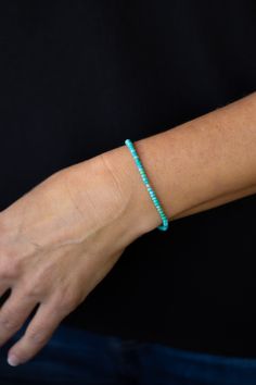 Add a touch of elegance to any outfit with the Shine Turquoise Silver Bracelet. This stretchy bracelet features solid natural stones that are meant to be layered and stacked for a chic look. Whether it's a casual day out or a special occasion, this bracelet is the perfect accessory. Everyday Turquoise Stackable Stretch Bracelet, Turquoise Hand-strung Stretch Bracelet, Everyday Turquoise Hand-strung Stretch Bracelet, Everyday Hand-strung Turquoise Stretch Bracelet, Everyday Turquoise Beaded Bracelets, Everyday Turquoise Beaded Bracelet, Turquoise Beaded Bracelets For Everyday Wear, Everyday Hand-strung Turquoise Bracelet, Moonstone Necklace Silver