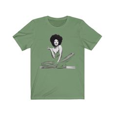 This is a High-Quality, Bella + Canvas 3001 Premium, Soft, Unisex, Short Sleeve Tee Shirt. Unisex T-shirt featuring 1970s, Funk, Soul Music and blues artist and icon for black women, Betty Davis. The image was created using a half-tone effect, which allows it to blend into the shirt as it is partly transparent, creating a stylish, versatile t-shirt suitable for almost any occasion - casual yet smart and stylish! This aesthetic tee would be an ideal gift for Soul, Funk, and RnB music fans, lovers Retro T-shirt For Music Festivals And Streetwear, Retro T-shirt With Text Print For Music Festivals, Music-themed Short Sleeve T-shirt For Music Festival, 90s Music Tshirt, Rnb Music, Music-themed Graphic Print Short Sleeve Shirt, Half Tone, Band Teacher, Streetwear For Men