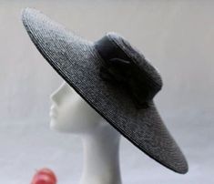 Paris Straw Pancake Hat. Parisienne chic by, And They Loved Hats. A beautifully made black hat for summer days and nights. Wide hat with a 17.5 "inch brim. Glamorous and easy to wear, with long silk ribbon chin ties, which allow the hat to be positioned at any angle to shield from the sun. The silhouette is simple yet elegant. The hat has petersham ribbon band and bow (or your personalised style shown here with mini pompoms) The super wide 18" brim brings welcome shade, offering some sun protect Paris Hat, Black Straw Hat, Parisienne Style, Black Paris, Straw Boater, Parisienne Chic, Trendy Hat, Boater Hat, Kentucky Derby Hat