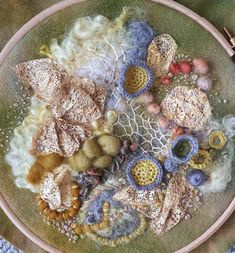 a close up of a plate with different types of yarns and beads on it