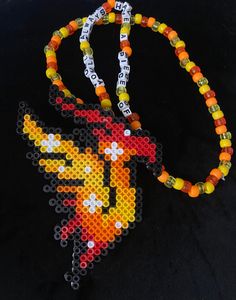 a beaded necklace with an image of a bird on it