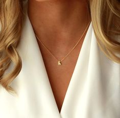 Tiny Cursive Initial Charm Necklace.   Modern, Simple & Delicate Initial Necklace that layers just right with her favorite every day jewelry pieces.   Affordable personalized jewelry for every style and occasion.     D E T A I L S  ● Available in gold plated, silver plated or rose gold plated ● Model is wearing 16" (model wears size small blouse for sizing reference) ● 2 inch extender chain included with necklace ● If you'd like necklace made without extender chain, please leave a note at checko Arabic Necklace, Handwriting Necklace, Sterling Silver Name Necklace, Crescent Necklace, Bar Necklace Personalized, Initial Necklace Gold, Gold Bar Necklace, Custom Name Necklace, Necklace Dainty