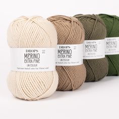 three balls of merino extra fine yarn