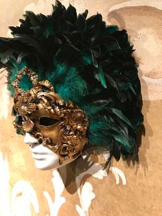 This masquerade mask for man and woman belongs to our collection of feathers' masks. These masks have a crown of black and green marine real feathers. It is perfect for any masquerade party, Halloween costume, pro or event in Venice or elsewhere during Carnival. This mask can be gently bent to form to your face and ties in the back with two soft matching ribbons. Since the mask is handmade, your mask could be lightly different from the one in the picture. This mask is made on paper mache,with cr Baroque Masquerade Mask For Mardi Gras Costume Party, Green Masks And Prosthetics For Carnival Costume Party, Green Masks For Carnival Costume Party, Baroque Masquerade Mask For Festivals And Parties, Feathered Masks And Prosthetics For Carnival Masquerade, Traditional Baroque Masquerade Mask For Carnival, Green Carnival Masks And Prosthetics, Green Masks For Carnival Masquerade, Green Mask For Masquerade Carnival