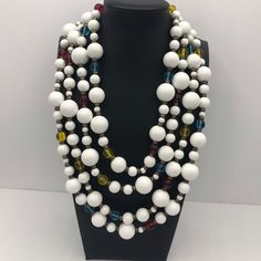 ON SALE Fun colorful white beaded statement necklace that is pretty large and definitely makes a good statement. Measures 18 inches of wearable length. Will definitely dress up any retro outfit. Vintage White Necklace For Party, White Costume Jewelry Beaded Necklaces For Party, White Necklaces With Colorful Beads For Party, White Necklace With Large Beads For Party, Vintage White Jewelry With Colorful Beads, White Beaded Necklaces For Party, Party White Beaded Necklaces With Colorful Beads, Retro White Necklace For Party, White Costume Jewelry With Colorful Beads