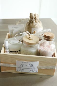 a wooden box filled with lots of different types of soaps and body lotions