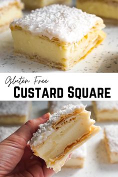 a hand holding a piece of custard square cake with powdered sugar on top