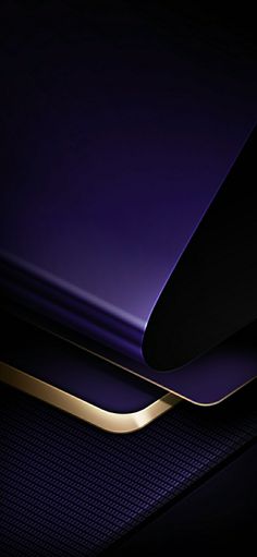 the back end of a purple and gold cell phone