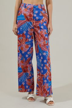 The Amazonia Blue Floral Mulvane Wide Leg Pants are here to show you keep you relaxed and in style! It shapes a high waist with a hidden zip fly and top button closure. It also has a stretchy waist on the back and pockets on each side. Pair this up with the matching top to complete the look!- Side pockets- High waist- Wide leg- Hook and clasp- Color: Blue RedSize + Fit - Model is 5'8" and wearing size XS- Measurements taken from size S - Waist: 14"- Inseam: 30 1/2" Fabric Self:100%Cotton Style N Versatile Blue Wide Leg Pants With Pockets, Versatile Blue Relaxed Fit Wide Leg Pants, Versatile Blue Wide Leg Pants, Versatile Blue Pants With Pockets, Versatile Blue Cotton Bottoms, Blue Cotton Wide-leg Pants, Blue Versatile Straight Pants, Versatile Blue Straight Pants, Versatile High Waist Blue Wide Leg Pants