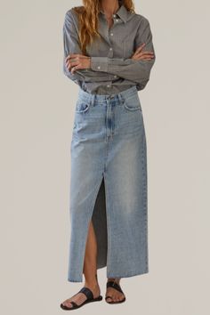 this light wash denim maxi skirt is a perfect blend of casual chic and timeless style. crafted from high-quality, durable denim, this skirt features a flattering high-waisted fit, classic five-pocket design, and a subtle front slit for ease of movement. the light wash gives it a versatile, vintage-inspired look, while the raw hem adds a touch of modern edge. pair it with your favorite blouse or vintage tee and sandals for an effortlessly styled outfit. 100% cotton classic 5-pocket design hand wa Maxi Denim Skirt, Glamorous Fashion, Denim Skirt Outfits, Denim Maxi, Denim Maxi Skirt, 2024 Fashion, Vintage Tee, Romper With Skirt, Light Wash Denim