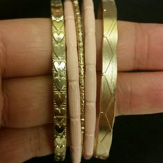 Gold & Pink Assorted Bangles Colors: Pink, Gold Brand New Never Worn Chic Pink Bracelets For Party, Chic Adjustable Pink Bracelets, Pink Bracelets For Spring Parties, Trendy Pink Metal Bracelets, Trendy Pink Metal Bracelet, Spring Party Pink Bracelets, Pink Bangle Jewelry For Spring, Chic Adjustable Pink Bracelet, Yellow Gold Tarnish-resistant Bangle Bracelet