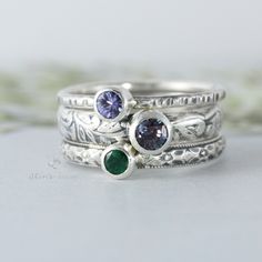 This custom made family ring is made with 3 separate solid sterling silver bands. This listing includes two 4mm gemstones and one 5mm gemstone. The gemstones are set in sterling silver tube bezels. You may choose the bands you love, let me know if you have any questions. Finish: you can choose between either an Oxidized (darkened) finish or a Classic finish. You can also choose a mix of both, let me know in the personalization box, note to seller or by message if you wish to have a combination. Heirloom Sterling Silver Stackable Jewelry, Sterling Silver Stackable Rings For Anniversary - May Birthstone, Silver Stackable Rings For May Birthstone, Sterling Silver Stackable Rings For Anniversary, May Birthstone, Fine Jewelry Sterling Silver Stackable May Birthstone Rings, Heirloom Silver Stackable Rings With Gemstones, Stackable Sterling Silver Rings For May Birthstone, Silver Stackable Rings With May Birthstone, Sterling Silver Three Stone May Birthstone Jewelry