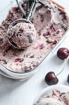 an ice cream dish with cherries in it