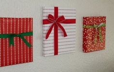 three wrapped presents are hung on the wall