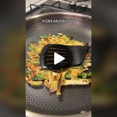 a pan with some food on top of it and a spatula in the middle