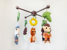 several stuffed animals hanging from a wooden rack