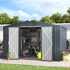 a bike is parked in the side of a metal shed with its door open to reveal it's storage area