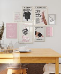 a dining room table and chairs with posters on the wall above it that say girls night