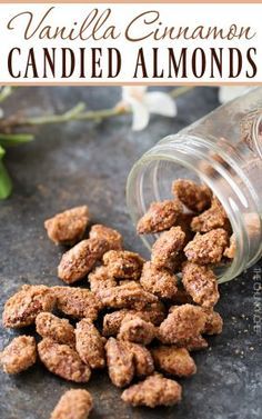 vanilla cinnamon candied almonds in a glass jar on a table with flowers and text overlay