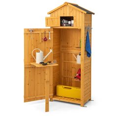 a small wooden shed with its door open and shelves full of gardening tools on the outside