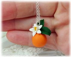 Petite elegant detailed handcrafted Orange Blossom Necklace. The orange necklace drops from assorted chain and matching bail to choose from. -Original hand sculpted polymer clay flowers -Durable, water-resistant -No molds, no paint, no glue -Pendant Length : 1 inch -16 inch or 18 inch chain -Chain and Bail : Choose Silver-plated, Gold-plated, Antique Brass, 925 sterling Silver or 14k Gold Filled Matching earrings sold separately and available at: https://www.etsy.com/listing/611479025 Flowers ar Orange Blossom Jewelry, Orange Round Pendant Jewelry As Gift, Orange Round Pendant Jewelry Gift, Orange Round Pendant Jewelry For Gift, Nickel-free Orange Necklace For Gift, Nickel-free Orange Necklace As Gift, Handmade Orange Pendant Jewelry, Handmade Orange Sterling Silver Necklace, Unique Orange Flower Shaped Jewelry