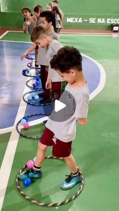 two young boys playing with toy tennis balls