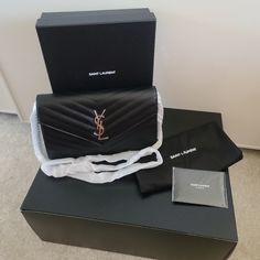 Brand New Never Been Worn. Includes: Box, Dust Bag, Tag (Located On Box), Ysl Mini Booklet Color: Black Caviar W/ Silver Hardware Size: 9" W X 5.5" H X 1.25" D 19.5" Shoulder Strap Drop Has 10 Card Slots And A Zipper In The Center Of Bag. Original Styrofoam Wrapper Is Still Intact On Chain As This Bag Is New And Never Been Used. Also, Original Cardboard Inside Bag Is Still Intact Along W/ Original Sticker On The Zipper. Purchased For $1650 + Tax = $1811 As Of 11/29/2022 This Bag Is Worth $1974 A Mini Booklet, Inside Bag, Black Caviar, Bag Tag, Silver Hardware, Ysl Bag, Card Slots, Yves Saint Laurent, Saint Laurent