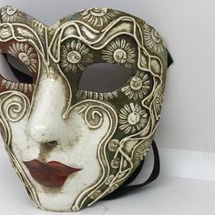 PLEASE WRITE YOUR TELEPHONE NUMBER WHEN YOU COMPLETE YOUR ORDER: Traditional and original papier-mache Venetian mask, handmade and decorated with acrylics colors. All our masks are handmade in our stores located in Venice. Our decorators use techniques typical of the Venetian tradition such as stucco, acrylics, gold and silver-leaf, macramè, passemenerie, pearls and crequelè to give you a wide range of masks. This shape is available in many different designs, colors and techniques. This mask is Venetian Half Mask, Paper Mache Clown Mask, Artistic White Masks For Mardi Gras, Artistic White Masks And Prosthetics For Mardi Gras, Artistic White Masks And Prosthetics For Carnival, Hand-painted White Masks For Masquerade, Hand Painted White Mask For Masquerade, Hand Painted White Masks For Masquerade, Handmade White Masquerade Masks