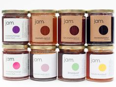 six jars of jam with different labels on them