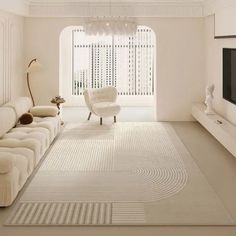 a living room with white furniture and a large rug on the floor in front of a window