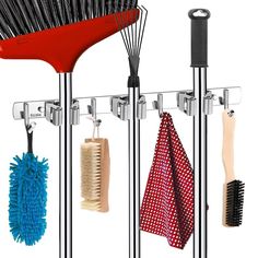 a rack with several brushes and combs hanging from it's sides next to each other