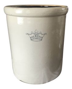 a white ceramic pot with a blue crown on the front and number ten on the side