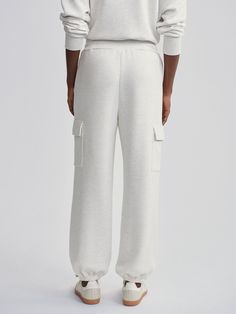 Made from our signature DoubleSoft® fabric, our Cargo pants offer a relaxed fit with a high waist and elastic cuffs for comfort. The oversized patch pockets define their cool, utilitarian-inspired style. Fabric Cuff, Running Jacket, Long Crop Top, Pocket Leggings, Cargo Pant, Casual Coat, Bottom Clothes, Hoodie Top, Casual Jacket