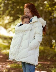 a woman holding a small child in her arms