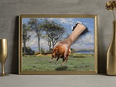 a painting of a hand reaching for a cow in a field with trees and grass