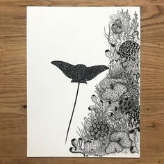 a black and white drawing of a bird standing on top of a flowery plant