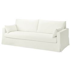 a white couch with two pillows on it