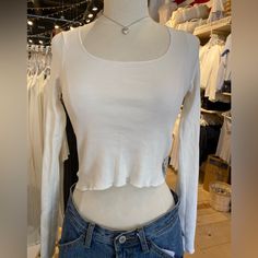 Basic, Ribbed Crop Top With Long Sleeves And A Scoop Neck. Fabrics: 96% Cotton, 4% Elastane Measurement: 18.5" (47 Cm) Length, 16" (41 Cm) Bust Made In: Italy White Scoop Neck Top For Fall, Ribbed Crop Top For Layering, Ribbed Cropped Tops For Day Out, Ribbed Scoop Neck Top For Day Out, Casual Fitted Cropped Long Sleeve Top, Ribbed Fitted Tops For Day Out, Fitted Casual Long Sleeve Top For Day Out, Fitted Cropped Long Sleeve Casual Top, Trendy Fitted White Knit Top