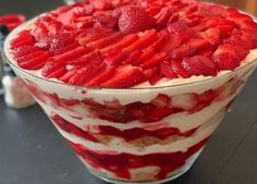 a dessert with strawberries in it on a table