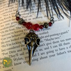 Necklace is inspired by Six of Crows/the Dregs in the Grishaverse series.  Bar style beaded necklace with charm. Can be strung on cord or chain, with spring ring closure. The bar is ~3.5 inches long. The necklace is roughly 16 inches long, but longer sizes can be requested. The Grishaverse, Shadow And Bone, Bar Styling, Six Of Crows, Wedding Jewellery Necklace, Crows, The Bar, Wedding Necklace, Spring Rings