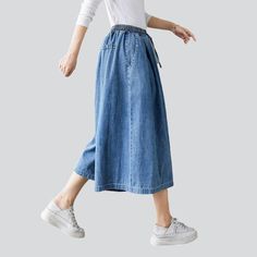 Take your laid-back trend to a whole new level with our 2023 Spring-Summer Collection of short culottes denim pants! These high-waisted. medium wash pants feature drawstrings closure for a unique and stylish look. Enjoy the perfect balance of comfort and trendy with these amazing culottes!Distinctive Features: Street vibe for a one-of-a-kind look Medium wash for a conventional chic look High-rise for a flattering fit Drawstring closure for added style and convenience Style and Comfort CombinedOu Spring Mid-rise Jeans With Drawstring, Mid-rise Jeans With Drawstring For Spring, Wide-leg Denim Jeans With Drawstring, Wide Leg Denim Jeans With Drawstring, Wide-leg Denim Bottoms With Drawstring, Wide Leg Denim Bottoms With Drawstring, Denim Blue Jeans With Drawstring For Spring, Casual Summer Jeans With Elastic Waistband, Spring High Rise Pants With Drawstring