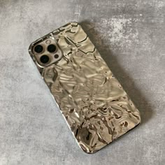 an iphone case that has been made to look like it is covered in metallic foil