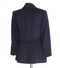 Guaranteed authentic INES de la FRESSANGE rich navy lush warm cashmere blend.4 on 2 Double breasted jacket with 2 sculpted flap pockets. The actual pockets are on interior, the flaps are sculpted with a button.The rear has a double centered vent created by a 'flap' from the waist down. A tab with a working button on each side is above the vent 'flap.'Each cuff has 2 buttons.All the buttons are BLACK peaux de soie. Beautifully shaped. Exquisite workmanship.Lining is blue. Fabric is wool, cashmere Double Breasted Jacket, Warm Jacket, Classic Beauty, Black Button, Blue Fabric, Flap Pocket, Double Breasted, Lush, Cashmere