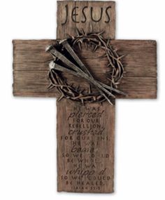 a wooden cross with a crown of thorns on it and the word jesus written in cursive writing