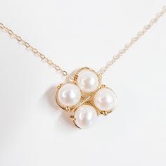 This exquisite pendant features delicate natural freshwater pearls in the shape of a lucky four-leaf clover. 100% handmade, making it perfect as a special and unique gift. If you are looking for a set, check out the earrings with the same design.  MATERIALS: 4 Natural Freshwater Pearls  14K gold plated Jewelry wire and chain MY PROCESS: Inspired by the raw elegance of natural pearls and stones, I handcraft every piece to make them unique and special. This means that each piece is one-of-a-kind and made with the most care and attention to detail. You can be sure that when you wear DeBlue jewelry, you're wearing something truly special.   PROCESSING & SHIPPING With finished products, the processing time is usually 1-3 business days. For custom orders, please contact me to discuss your unique Wire Wrapped Pearl Necklace As Gift, Wire Wrapped Pearl Necklace Gift, Wire Wrapped Pearl Necklace For Gift, Wire-wrapped Pearl Necklace For Gift, Pearl Wire Wrapped Necklace For Gift, Delicate Wire Wrapped Pearl Necklace For Gift, Delicate Wire Wrapped Pearl Necklace As Gift, Wire Wrapped Pearl Necklaces As Gifts, Unique Pearl Necklace