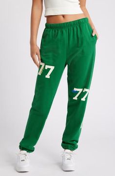 Number graphics lend varsity style to lounge-ready sweatpants cut from a breathable cotton blend. 32" inseam; 12" leg opening; 13" front rise; 16" back rise (size Large/X-Large) Elastic waist Side-seam pockets Elastic cuffs 84% cotton, 16% polyester Machine wash, line dry Imported Sportswear Sweatpants With Letter Print For Loungewear, Sporty Letter Print Sweatpants For Loungewear, Sporty Sweatpants With Letter Print For Loungewear, Collegiate Style Cotton Sweats For Loungewear, Green Bottoms With Letter Print For Streetwear, Graphic Print Sweatpants For Spring Loungewear, Spring Graphic Print Sweatpants For Loungewear, Casual Green Bottoms For Sports Season, Cotton Sweatpants For Sports Season Loungewear